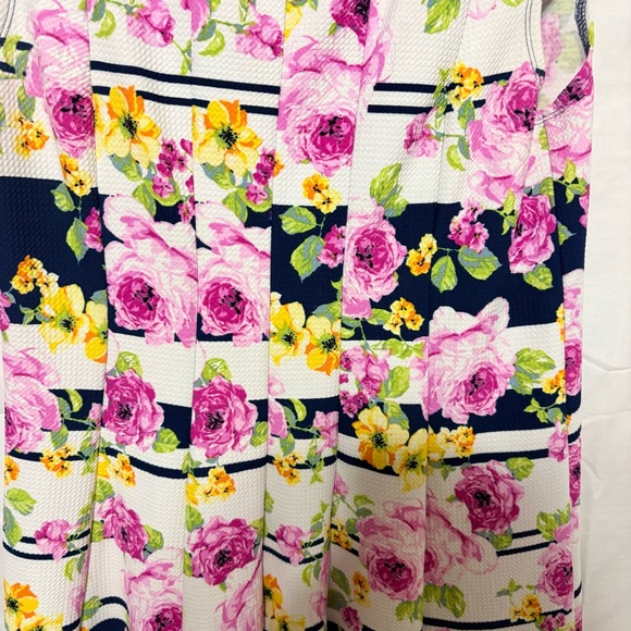 Emma & Michele floral cap-sleeve dress on a navy blue/white striped background. - Picture 4 of 12